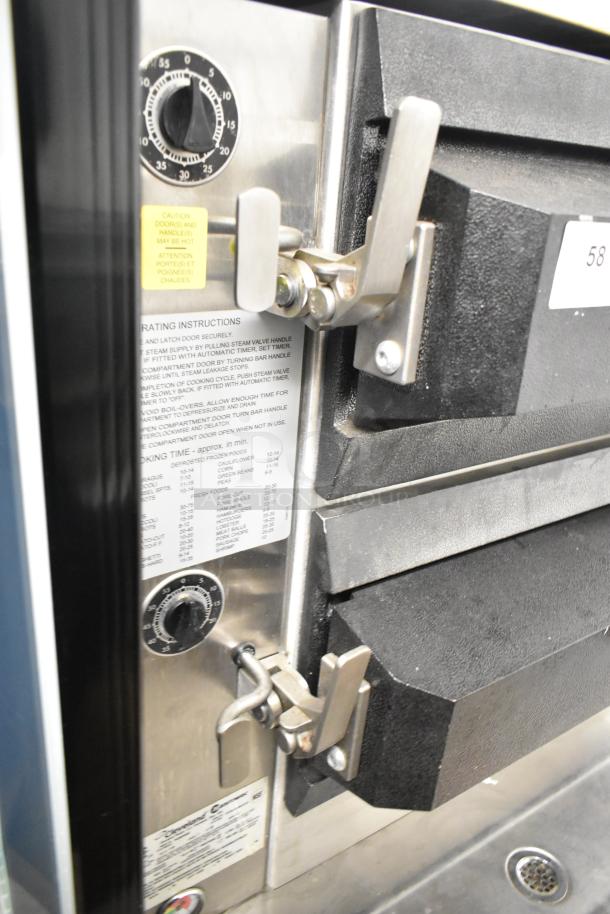 Cleveland PGM3002 commercial propane gas pressure floor steamer, 16 pan capacity, with boiler base. Features timer and safety labels.