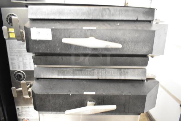 Cleveland PGM3002 commercial propane steamer, 16-pan capacity, boiler base, 300,000 BTU. Used condition, visible dials and labels.