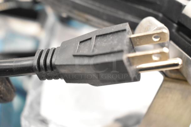 Close-up of the plug for a Carnival King 382BWM30 single bubble waffle maker, showcasing a standard three-prong design.