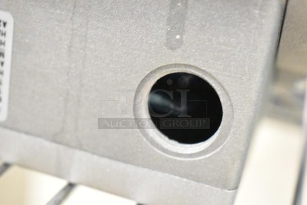 Brand new Nidec Motor with visible hole detail, 208-240 volts, 1 phase, scratch and dent condition.