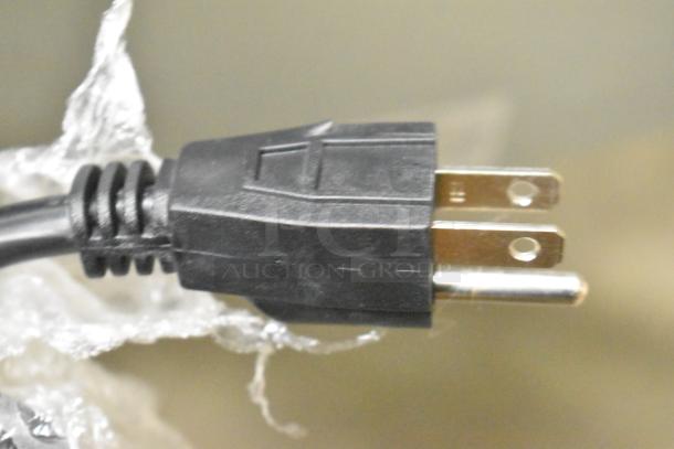 Close-up image of a power cord plug for the Avantco 177BW32 32 Bun Warmer, showing standard prongs.