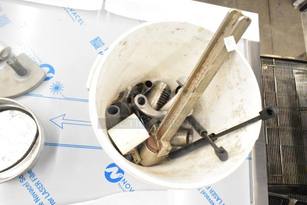 Auction lot of various Boltic SHAG-K07F items; includes stainless drop-in bin, round metal baking pan, and assorted dishes.