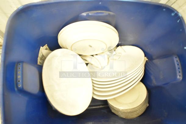 Lot of white dishes in blue bin, Boltic model SHAG-K07F, features include various sizes, some marks visible, fair condition.