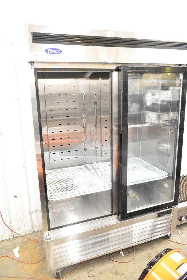 2021 Atosa MCF8703ES commercial 2-door reach-in freezer, poly-coated racks, on commercial casters, 115 volts, 1 phase.