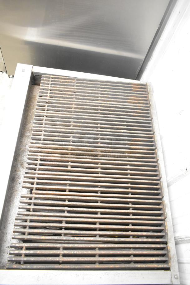 Jade commercial countertop gas charbroiler grill, shows slight rusting on metal grates, suitable for restaurant use.