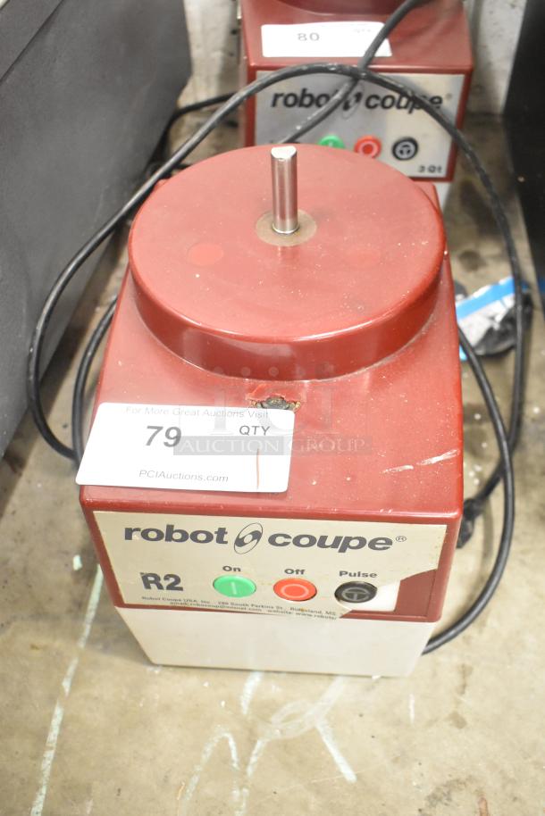 Robot Coupe R2N food processor base, 120V, 1 phase. Visible wear and auction tag numbered 79.