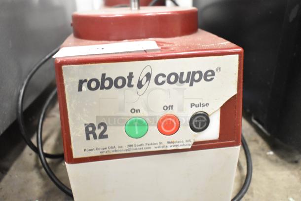 Robot Coupe R2N food processor base, 120V, 1 phase, used condition, with on/off and pulse buttons displayed.