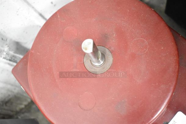 Robot Coupe R2B food processor base, red, countertop model, 120 volts, 1 phase, visible wear, central metal spindle.