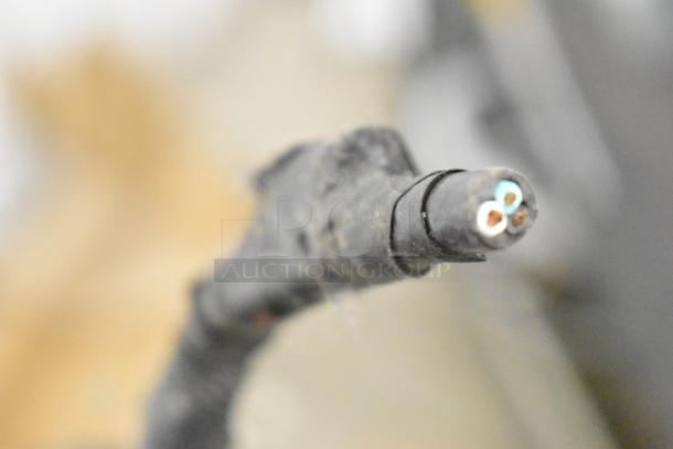 AHT AC-XLS US commercial merchandiser cable close-up. 115 Volts, 1 Phase. Black cable with exposed wires.