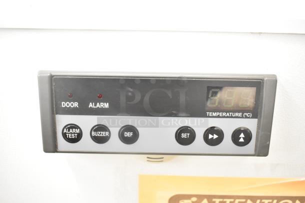 PHCBI SF-L6111W undercounter cooler control panel with temperature display and buttons for alarm, buzzer, and settings.
