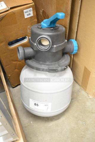 Portable filtration tank with multiple valves and blue handle, appears in good condition. Label indicates auction item number 85.