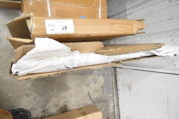 Four brand new boxed items, including Bon Chef 52109 EX tile tabletop, legs, and metal oven racks, showing minor scratches.