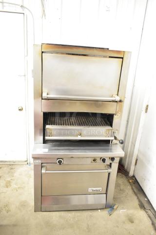 Garland stainless steel commercial gas upright broiler, used condition, featuring adjust knobs and branded label. Ideal for restaurants.