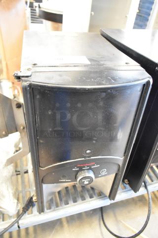 2016 Bunn LCA-1 liquid coffee dispenser, black finish, countertop model, single product, 120 volts, minor wear visible.