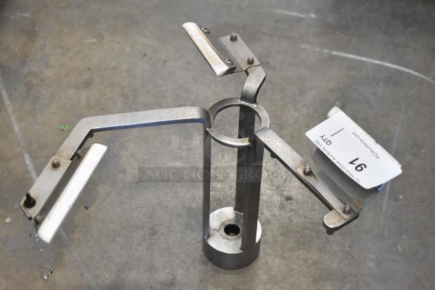 Metal auger with three blades, central shaft, and bracket, in used condition. Auction tag displaying item number 97.