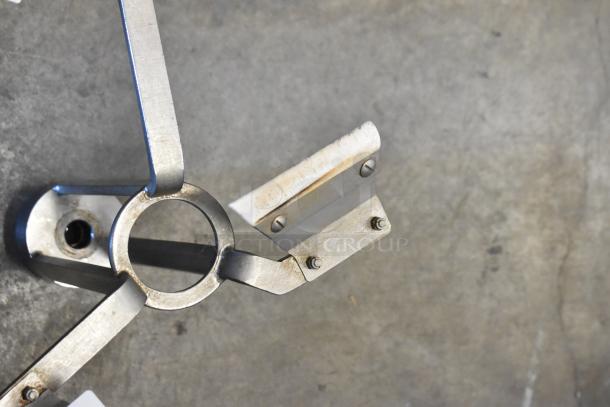 Metal auger with robust metal blades, slight wear visible, suitable for heavy-duty drilling tasks.