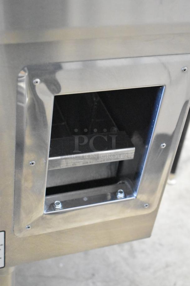 Brand new Town Y-1-SS-N wok range showing gas chamber, stainless steel finish, scratch and dent condition, 116,000 BTU.