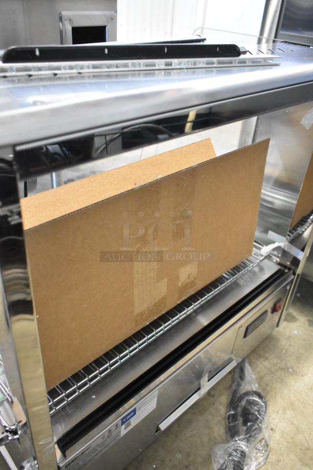Brand new ServIt 423HDM26SA 26" heated display case, three shelves, sliding doors, minor glass damage, 120V, 1 phase.