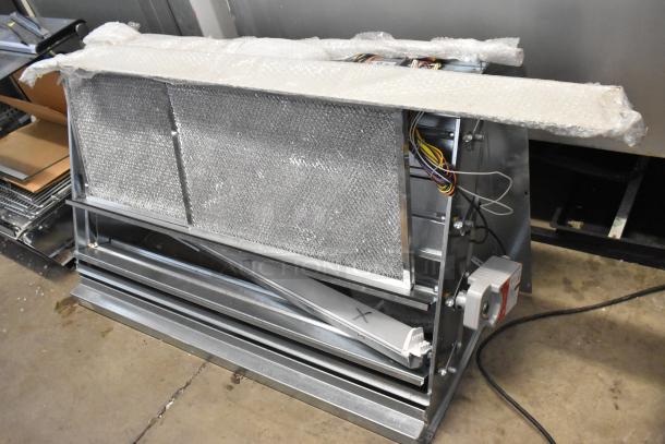 Brand new Daikin Hood with McDaniels Metal 122-DK-090, vertical/downflow low leak Jade economizer, slightly dented.