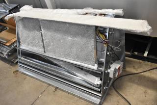 Brand new Daikin Hood with McDaniels Metal 122-DK-090, vertical/downflow low leak Jade economizer, slightly dented.