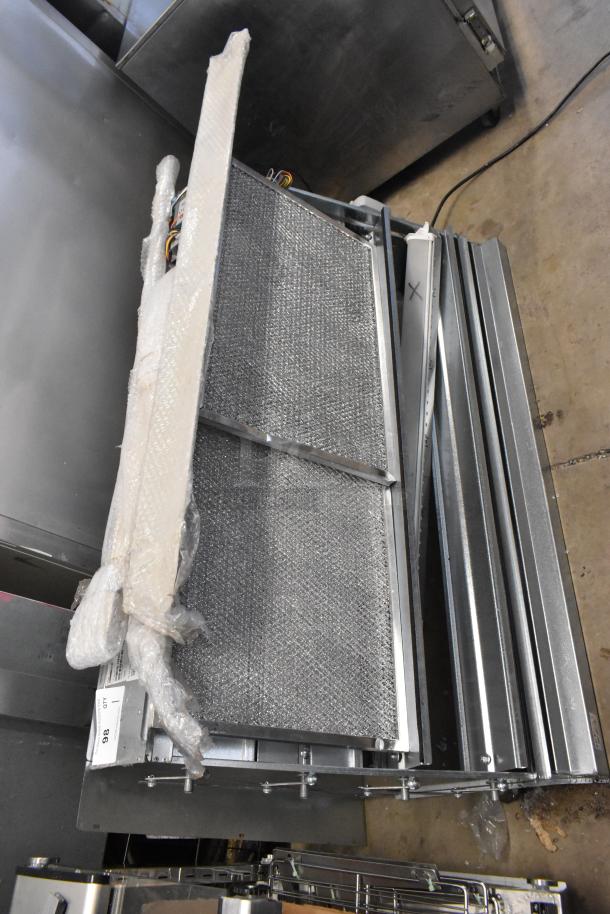 Brand new Daikin Hood with McDaniels Metal 122-DK-090 Economizer, in scratch and dent condition, wrapped in packaging.