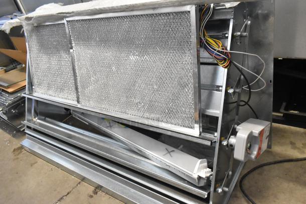 Brand new Daikin Hood with McDaniels Metal 122-DK-090 Economizer. Vertical/downflow, low leak. Minor scratches and markings.