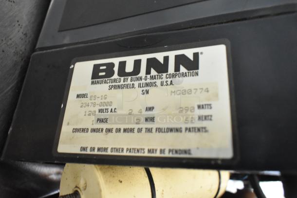 Bunn ES-1G metal commercial espresso bean grinder, lacks lid, 120V, 1 phase; label shows model and specs.