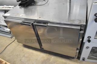 Beverage Air UCR48A 2-door undercounter cooler with commercial casters, 115 volts, 1 phase, stainless steel, visible wear.