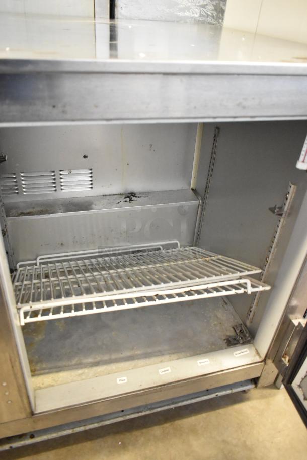 Beverage Air UCR48A commercial 2 door undercounter cooler on casters, visible interior shelf, signs of use. 115V, 1 phase.