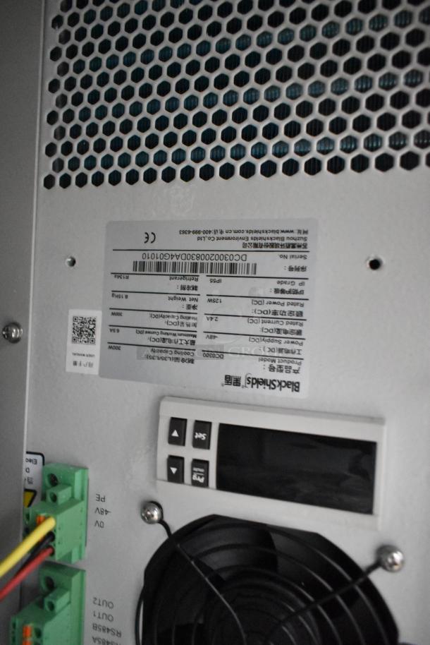 2 BlackShields DC0300 white metal air-conditioned cabinets, featuring control panel and ventilation grille, in good condition.