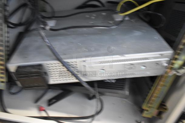 Two BlackShields DC0300 white metal air-conditioned technology cabinets, showing ventilation design and wiring inside.