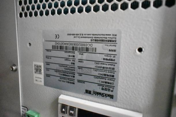 2 BlackShields DC0300 white metal air-conditioned technology cabinets, features barcoded label with specifications.