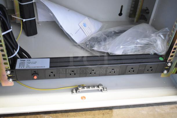 BlackShields DC0300 white metal air-conditioned tech cabinet with power outlets. New condition, internal cables and labels visible.