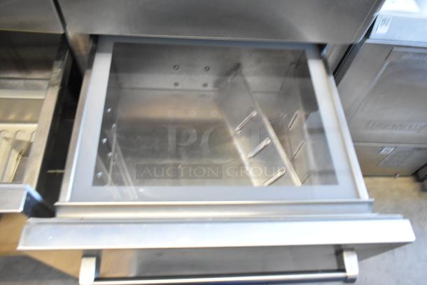 Sub-Zero Reach In Cooler with Freezer, stainless steel finish, open drawer showing interior shelving, excellent condition.