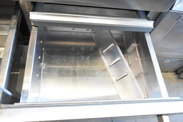 Sub-Zero Reach In Cooler w/ Freezer, stainless steel interior, minor wear, sturdy construction, commercial-grade.