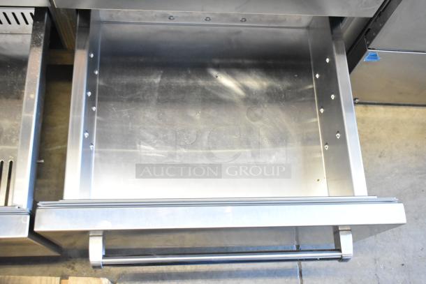 Sub-Zero Reach In Cooler with Freezer, stainless steel interior, open drawer view, excellent condition, industrial use.