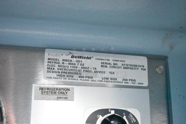 Delfield 406CA-DD1 undercounter cooler control panel. Model and serial number label shown in detail. 115V, 1 phase.