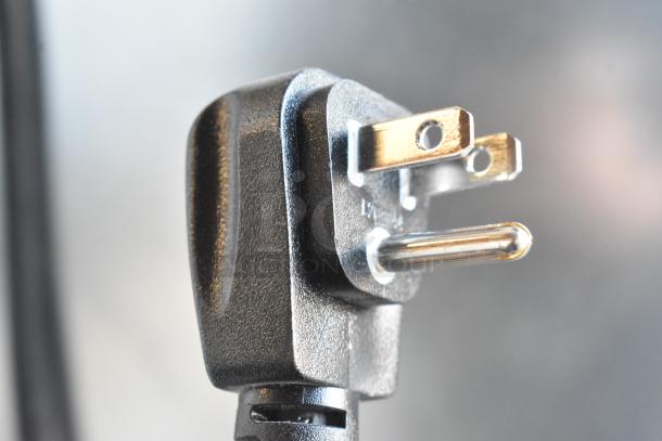 Close-up of a power plug connected to a 2019 Habco SE18 commercial cooler, equipped with poly-coated racks, 115 volts, 1 phase.
