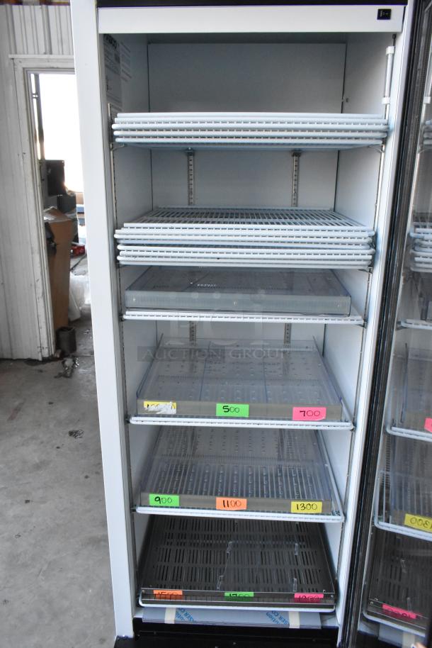 2019 Habco SE18 single door reach-in cooler merchandiser with poly-coated racks, 115 volts, clean condition.
