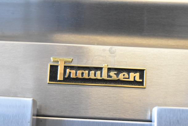 Traulsen RHT232WUT-HHS commercial cooler logo on stainless steel surface, 115 volts, single phase.