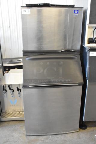 Manitowoc SD0602A commercial ice head on bin, steel finish, 208-230 volts, 1 phase, excellent condition, model label visible.