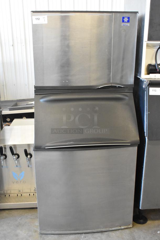 Manitowoc SD0602A commercial ice head on ice bin, stainless steel, 208-230V, 1-phase, good condition, auction tag visible.