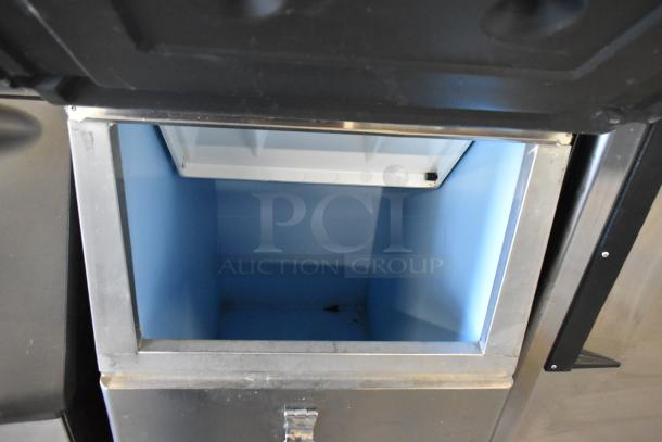 Hoshizaki KM-350MAJ ice head on B-300PF bin, commercial-grade, 115V, 1 phase, stainless steel, open lid, clean interior.