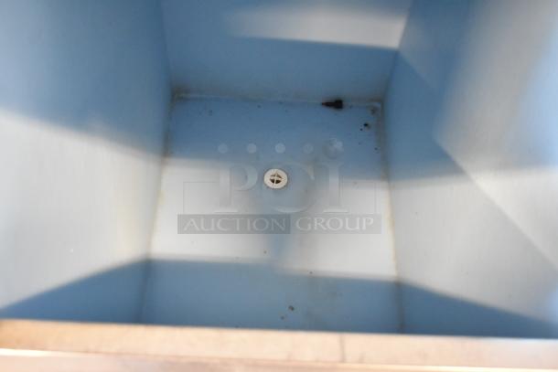 Hoshizaki B-300PF ice bin interior, showing light wear. Drain plug visible at center. Suitable for commercial use.