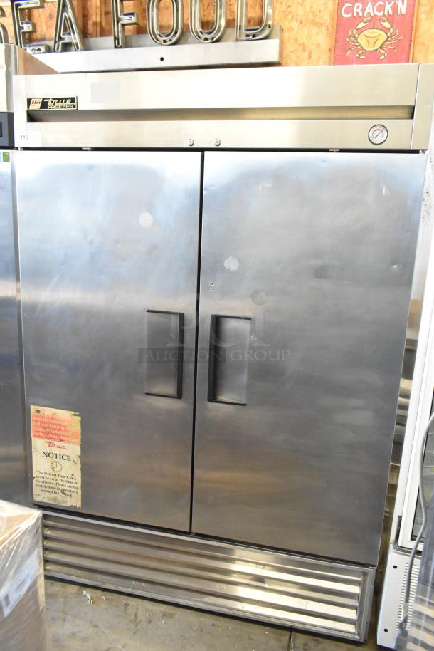 True T-49F commercial 2-door reach-in freezer with poly-coated racks, 115 volts, 1 phase, stainless steel finish.