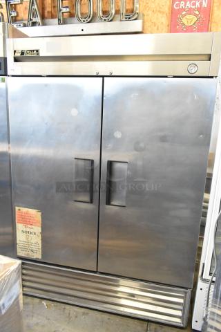 True T-49F commercial 2-door reach-in freezer with poly-coated racks, 115 volts, 1 phase, stainless steel finish.