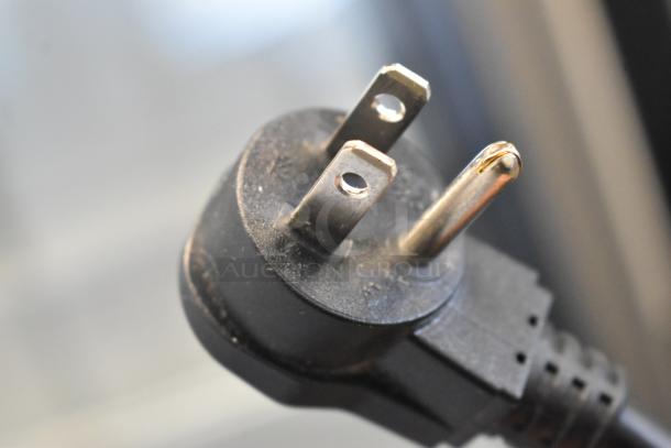 Close-up of a power plug for a 2019 Habco SE18 commercial cooler, 115 volts, 1 phase. Features durable build.