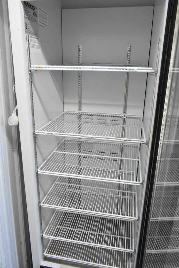 2019 Habco SE18 commercial single door cooler with poly-coated racks, 115 volts, 1 phase, excellent condition.