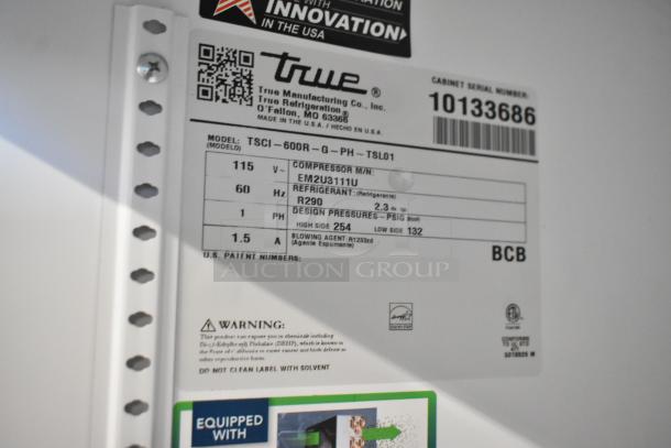 Label on True TSCI-600R-G-PH cooler showing model number, voltage, phase, and refrigerant details.