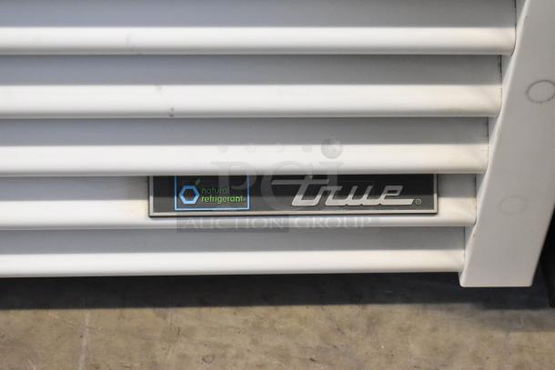 2021 True TSCI-600R-G-PH commercial cooler with poly-coated racks, natural refrigerant label visible. 115 volts, 1 phase.